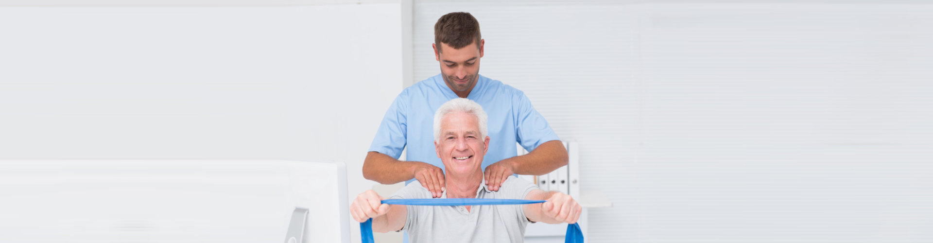 elder man with caregiver exercising