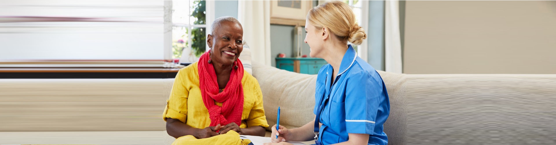 caregiver interviewing elder woman